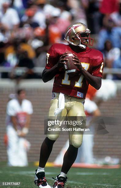 Quarterback Charlie Ward of the Florida State Seminoles readies to throw the ball during an NCAA game against the Clemson Tigers on September 11,...