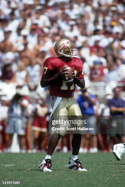 Quarterback Charlie Ward of the Florida State Seminoles readies to throw the ball during an NCAA game against the Clemson Tigers on September 11,...