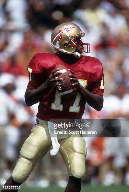 Quarterback Charlie Ward of the Florida State Seminoles readies to throw the ball during an NCAA game against the Clemson Tigers on September 11,...