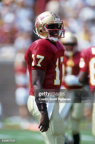 Quarterback Charlie Ward of the Florida State Seminoles stands on the field during an NCAA game against the Clemson Tigers on September 11, 1993 at...