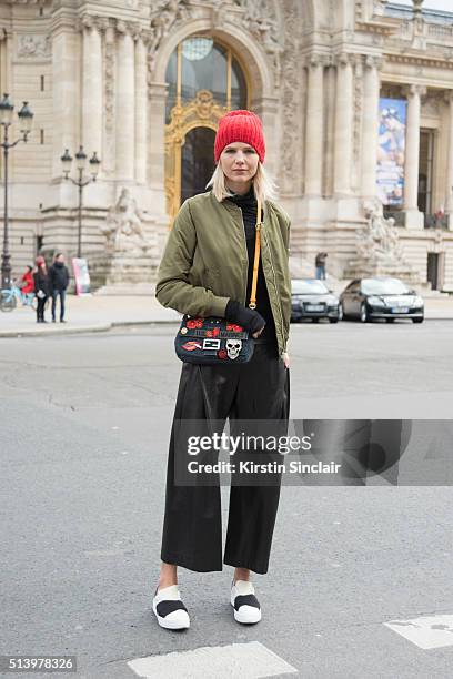 Fashion Blogger Samantha Angelo wears Topshop jacket, Liesangbong trousers. Customized Fendi bag, Margiela sweater, PrimaBase shoes on day 5 during...