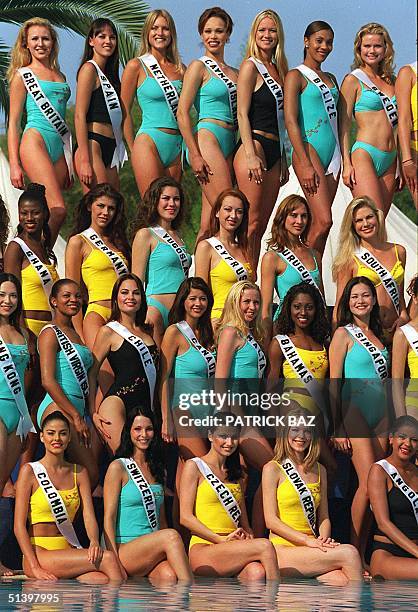 Delegates to the Miss Universe 2000 Pageant pose, 26 April 2000 in a pool of a five-star hotel in Limassol, for a swimwear photo-shoot for the 49th...