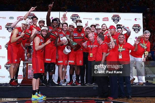 The Wildcats celebrate with the trophy after winning the Championship during game three of the NBL Grand Final series between the Perth Wildcats and...