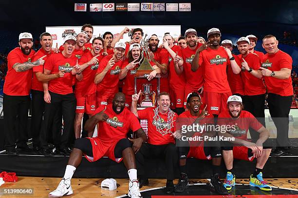 The Wildcats celebrate with the trophy after winning the Championship during game three of the NBL Grand Final series between the Perth Wildcats and...