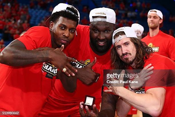 Casey Prather, Nate Jawai and Greg Hire of the Wildcats poase with their rings after winning the Championship during game three of the NBL Grand...
