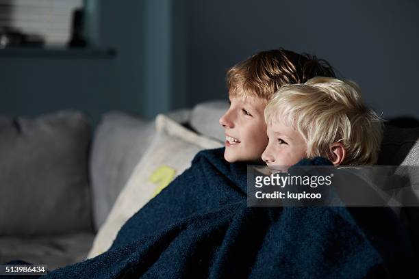 they love watching movies together - loving 2016 film stock pictures, royalty-free photos & images