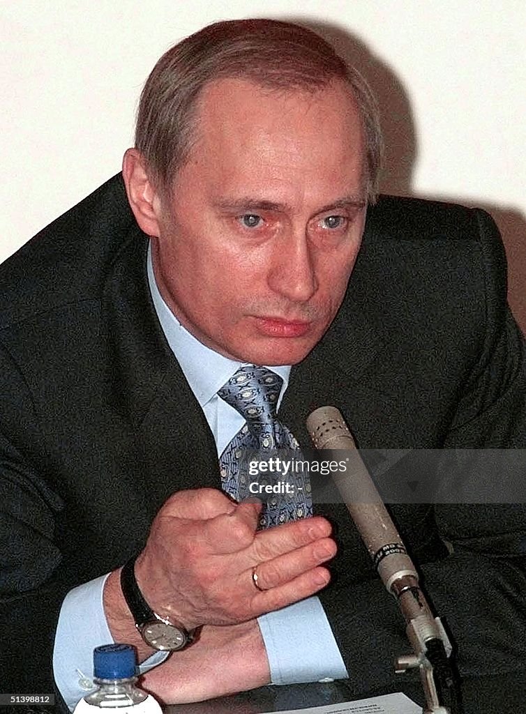 Acting Russian President Vladimir Putin gestures,