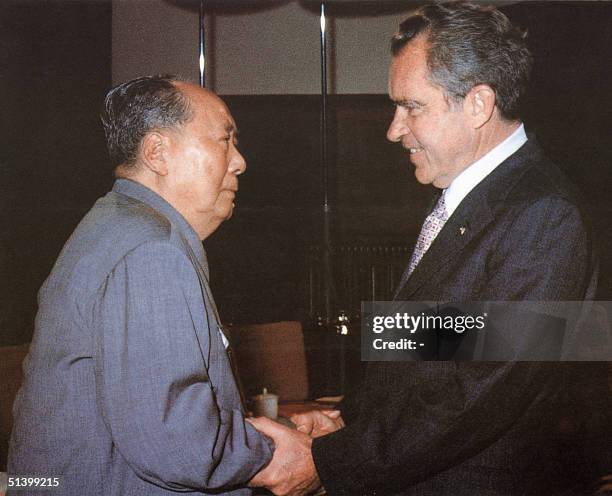 Chinese communist leader Chairman Mao Zedong welcomes US President Richard Nixon, at his house in Beijing. President Nixon urged China to join the...