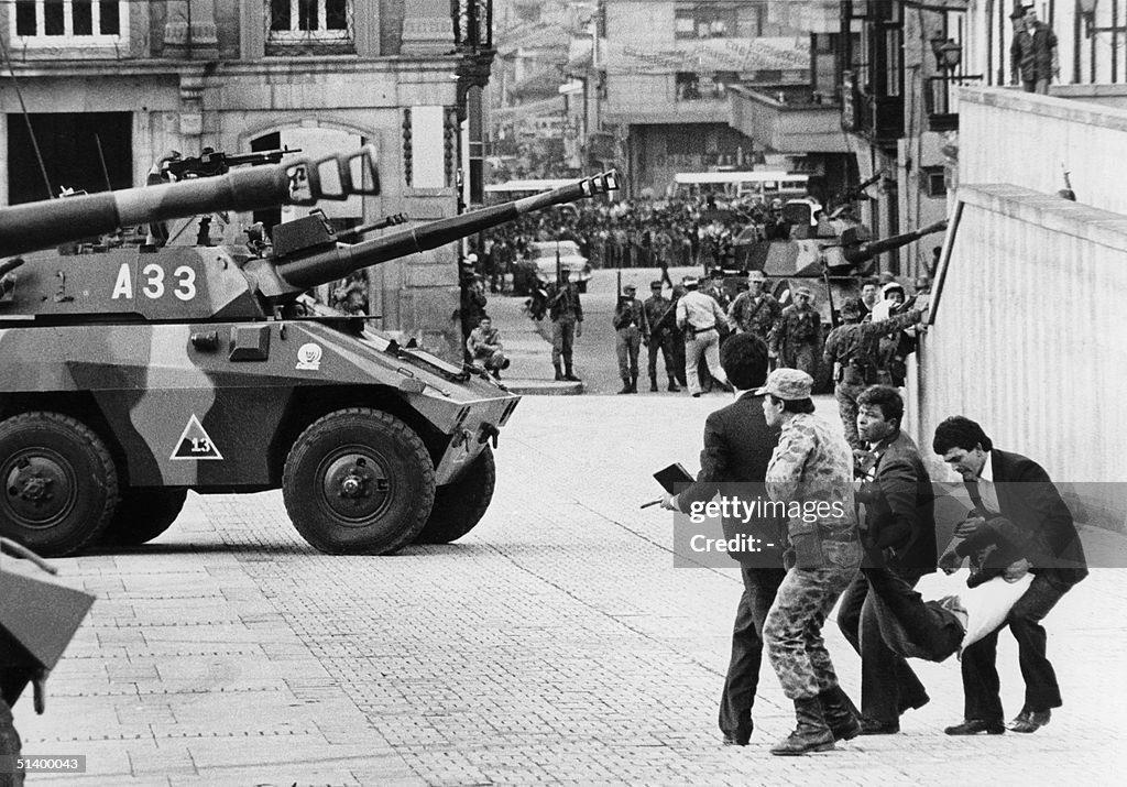 An injured man is evacuated from the Palace of Jus