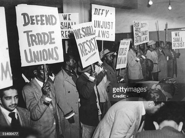 Supporters of South Africa's African National Congress , wearing on their sleeves the colors of their party, gather 12 August 1952 in Johannesburg as...