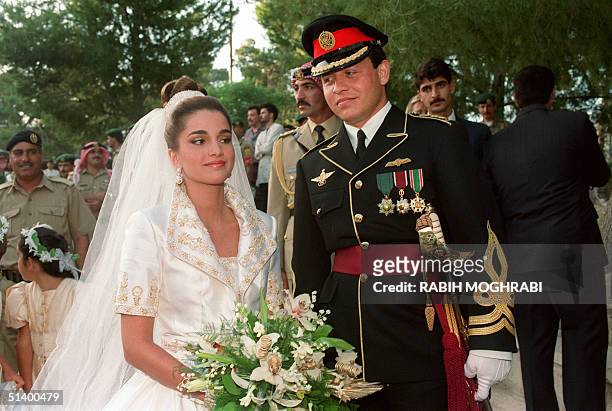Prince Abdallah , the eldest son of Jordan's King Hussein, poses with his bride Rania Yassine after their wedding ceremony at the Royal Palace in...