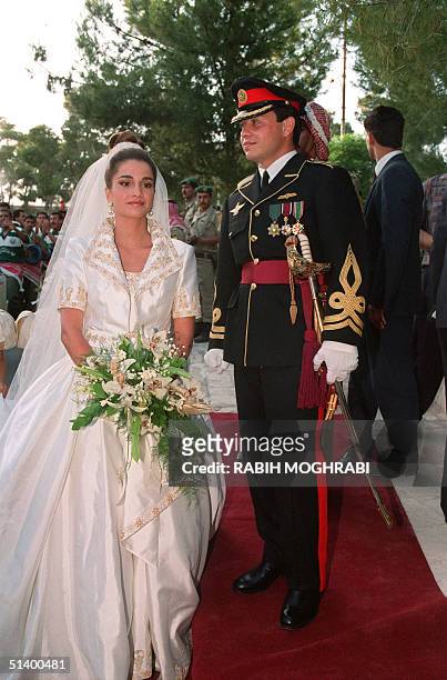 Prince Abdllah, the eldest son of Jordan's King Hussein, poses with his bride Rania Yassine after their wedding ceremony at the Royal Palace in Amman...