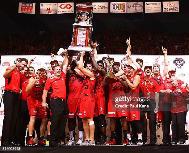 The Wildcats celebrate with the trophy after winning the Championship during game three of the NBL Grand Final series between the Perth Wildcats and...