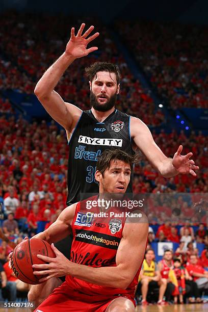 Damian Martin of the Wildcats looks to pass the ball against Alex Pledger of the Breakers during game three of the NBL Grand Final series between the...