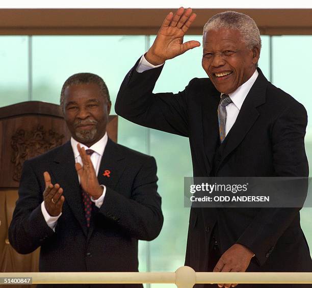 Outgoing South African President Nelson Mandela waves as he arrives for the inauguration of Thabo Mbeki as second democratically elected President of...