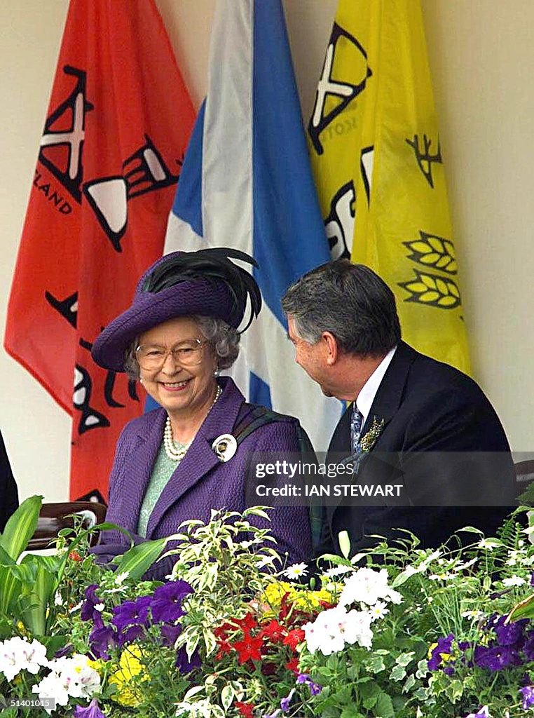 Britain's Queen Elizabeth II smiles with Presiding
