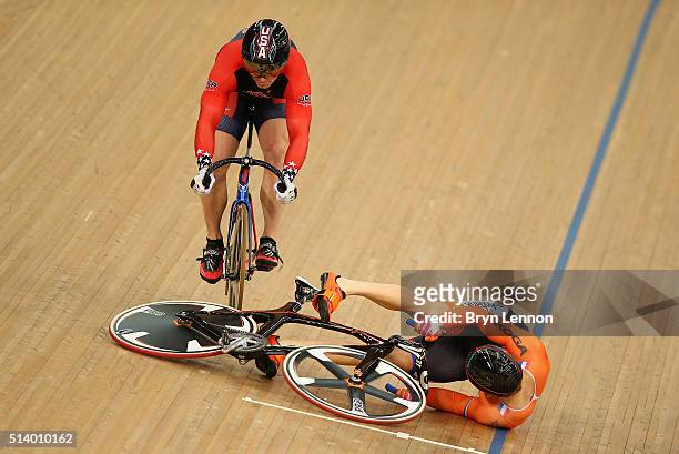 Matthijs Buchli of Holland crashes and takes out USA's Matthew Baranoski in heat three of the Men's Keirin during Day Five of the UCI Track Cycling...
