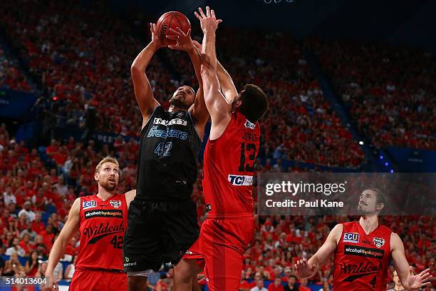 Tai Wesley of the Breakers goes to the basket against Tom Jervis of the Wildcats during game three of the NBL Grand Final series between the Perth...