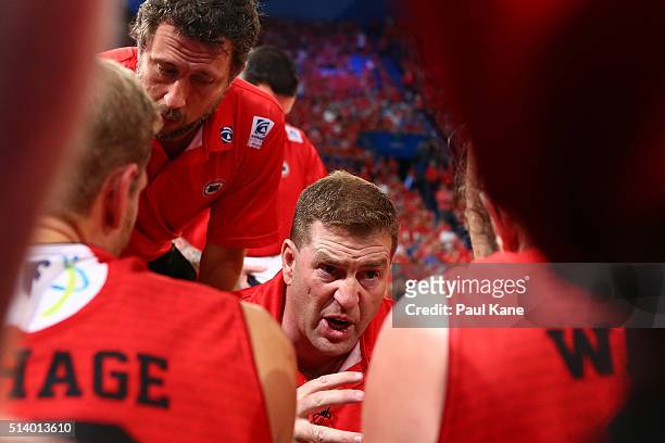 Trevor Gleeson, coach of the Wildcats addresses his players at time-out during game three of the NBL Grand Final series between the Perth Wildcats...