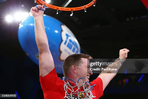 Trevor Gleeson, coach of the Wildcats snips the net after winning the Championship during game three of the NBL Grand Final series between the Perth...