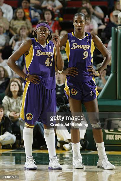 Nikki Teasley of the Los Angeles Sparks stands next to her teammate Lisa Leslie during the game against the Seattle Storm at Key Arena on September...