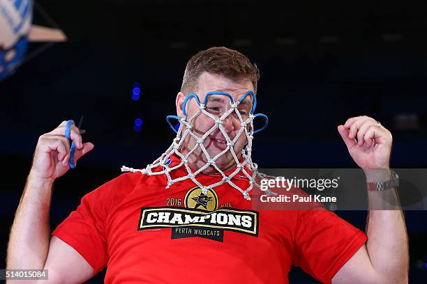 Trevor Gleeson, coach of the Wildcats put the net over his head after winning the Championship during game three of the NBL Grand Final series...