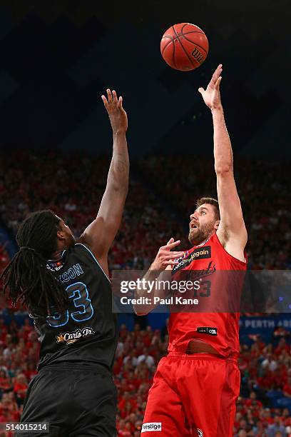Tom Jervis of the Wildcats puts a shot up against Charles Jackson of the Breakers during game three of the NBL Grand Final series between the Perth...