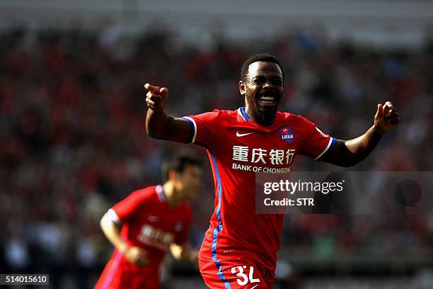 Fernando Conceio of Chongqing Lifan celebrates after scoring a goal during a Chinese Super League football match against Guangzhou Evergrande in...