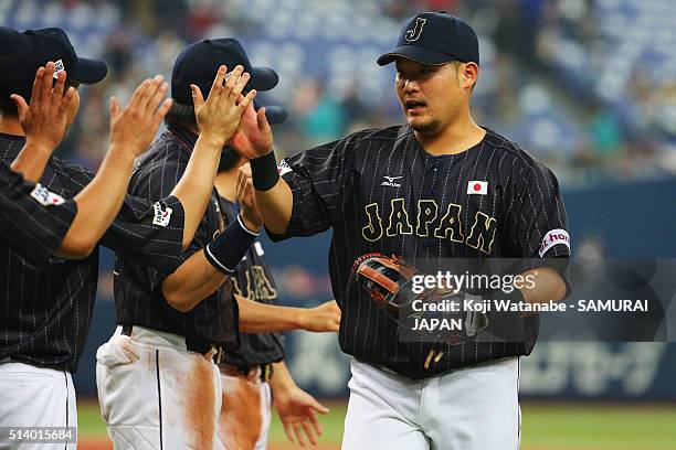 Outfielder Yoshitomo Tsutsugo of Japan celebrates his team's win in the international friendly match between Japan and Chinese Taipei at the Kyocera...