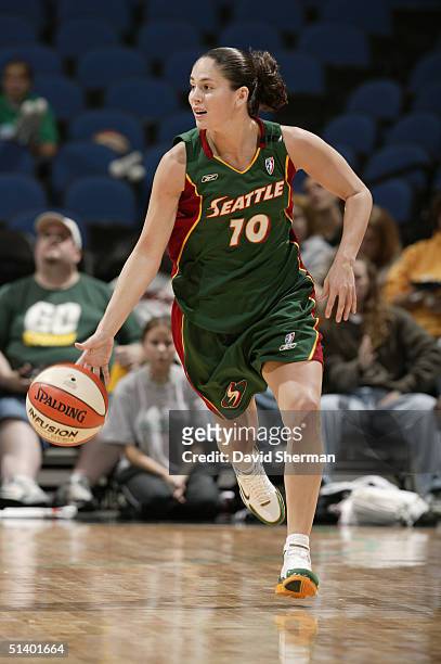 Sue Bird of the Seattle Storm controls the ball against the Minnesota Lynx during Game 1 of the 2004 Western Conference semi-finals on September 25,...