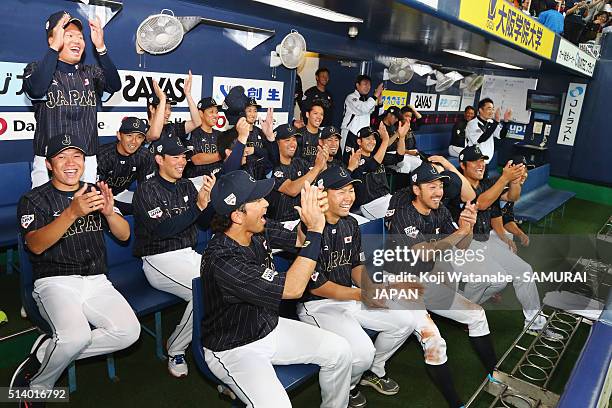 Infielder Nobuhiro Matsuda of Japan and players cheer outfielder Yoshitomo Tsutsugo during the international friendly match between Japan and Chinese...