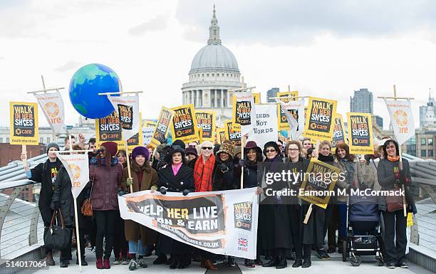 Annie Lennox, Bianca Jagger and Helen Pankhurst take part in 'Walk In Her Shoes' on March 6, 2016 in London, England.