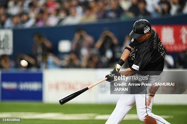 Outfielder Yoshitomo Tsutsugo of Japan hits a two run homer in the top of ninth inning during the international friendly match between Japan and...