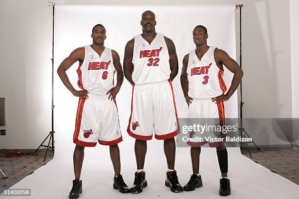 Eddie Jones, Shaquille O'Neal, and Dwyane Wade of the Miami Heat pose for a portrait during NBA Media Day on October 4, 2004 in Miami, Florida. NOTE...