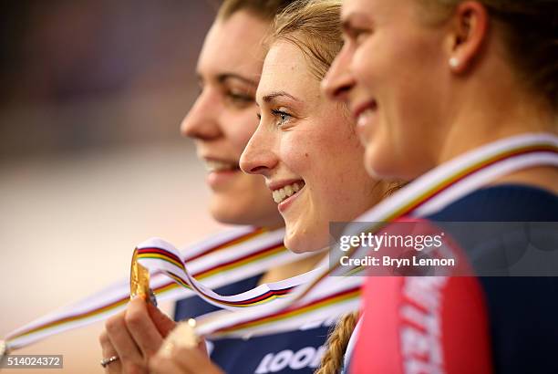 Laura Trott of Great Britain celebrates on the medal podium after winning the Women's Omnium during Day Five of the UCI Track Cycling World...