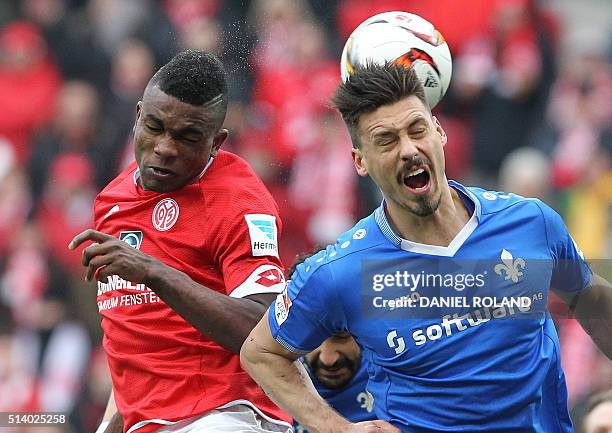 Mainz' Colombian forward Jhon Andres Cordoba and Darmstadt's forward Sandro Wagner vie for the ball during the German first division Bundesliga...