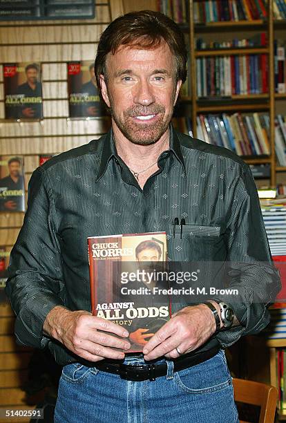 Actor Chuck Norris poses during a book signing for his new book "Against All Odds" at Borders Books on October 4, 2004 in Northridge, California. .