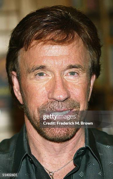 Actor Chuck Norris poses during a book signing for his new book "Against All Odds" at Borders Books on October 4, 2004 in Northridge, California. .