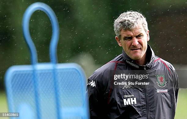 Wales coach Mark Hughes looks on during Wales Football training ahead of the World Cup qualifying match against England at the University of...