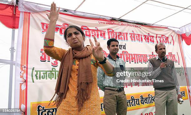 Sign language teacher interprets as a prospective groom is introduced at the Divyaang Pratham Rajya Stareeya Vaivaahik Parichay Sammelan at Seth...