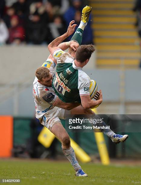 Freddie Burns of Leicester Tigers is tackled by Matt Jess of Exeter Chiefs during the Aviva Premiership match between Leicester Tigers and Exeter...