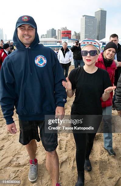 Taylor Kinney and Lady Gaga take part in the 16th Annual Polar Plunge at North Avenue Beach on March 6, 2016 in Chicago, Illinois.