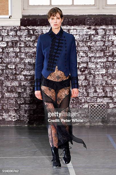 Model walks the runway during the John Galliano show as part of the Paris Fashion Week Womenswear Fall/Winter 2016/2017 on March 6, 2016 in Paris,...