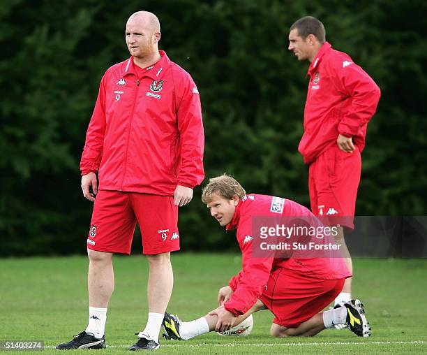 Welsh players John Hartson , Ben Thatcher and Andy Melville warm up during Wales Football training ahead of the World Cup qualifying match against...