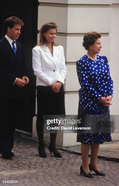 Queen Elizabeth II, Viscount Linley and Lady Sarah Armstrong Jones watching the march past for the Queen Mother's 87th Birthday on August 4, 1987...