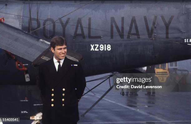 Prince Andrew returns from the Falklands War on September 17 on board HMS Invincible. He posed in front of the Sea King helicopter that he had flown...