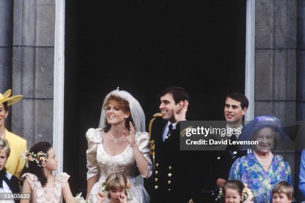 The Royal Wedding of Prince Andrew and Sarah, Duchess of York on July 23, 1986 in London.The Royal couple playfully listening to the crowd outside...
