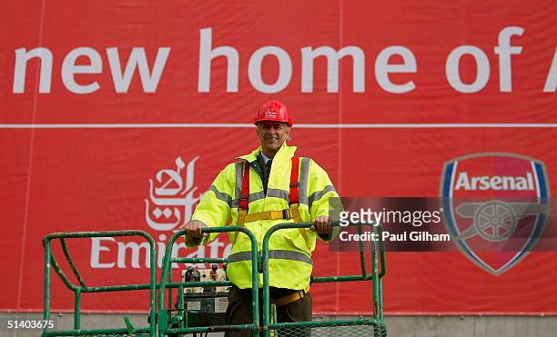 Manager Arsene Wenger of Arsenal poses outside Arsenal Football Club's new Emirates Stadium development at Ashburton Grove on October 5, 2004 in...