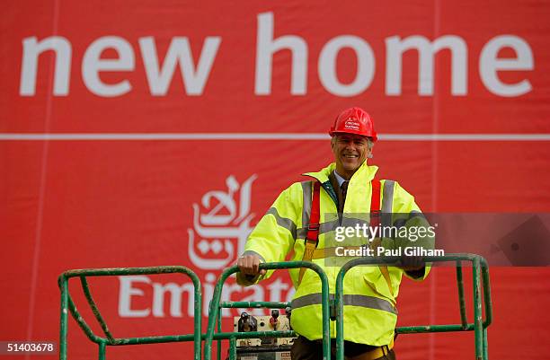 Manager Arsene Wenger of Arsenal poses outside Arsenal Football Club's new Emirates Stadium development at Ashburton Grove on October 5, 2004 in...