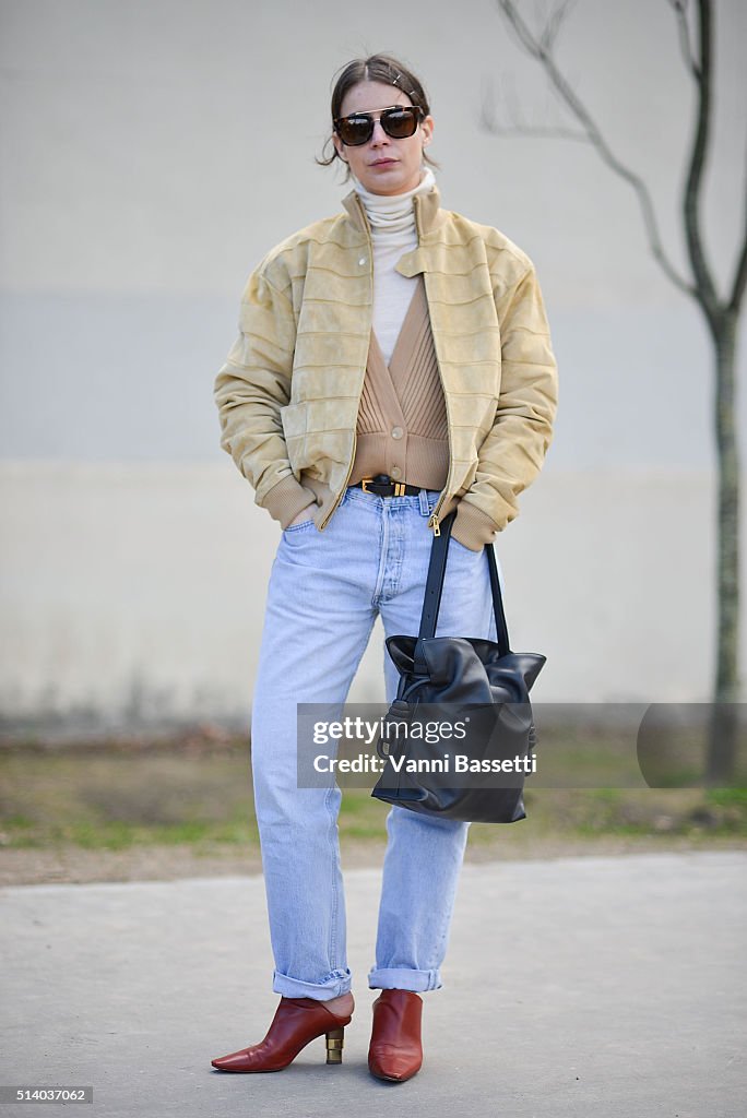 Irina Lakicevic poses wearing a Loewe jacket and bag and Celine shoes ...